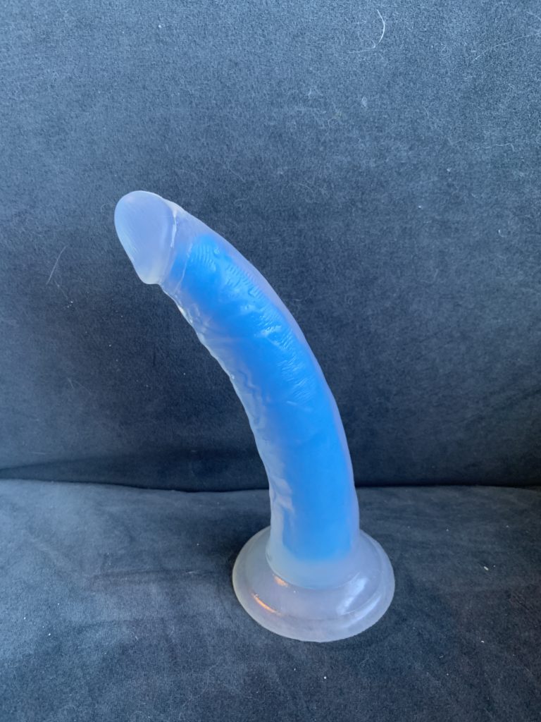 The Neo Elite Glow in the Dark 7.5 Inch Silicone Dildo sits on my chair... can you guess how many cats I have?